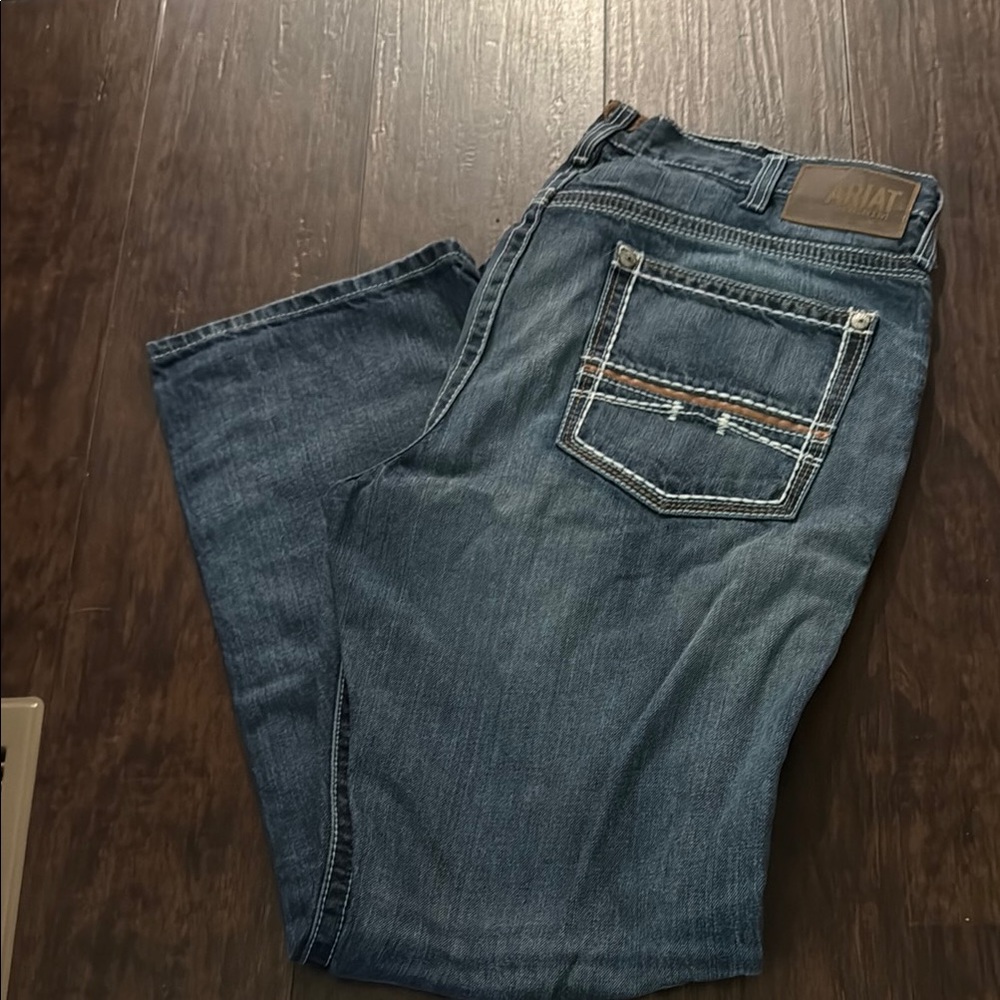 Ariat Blue relaxed boot cut Jeans with Natural Wear Patterns